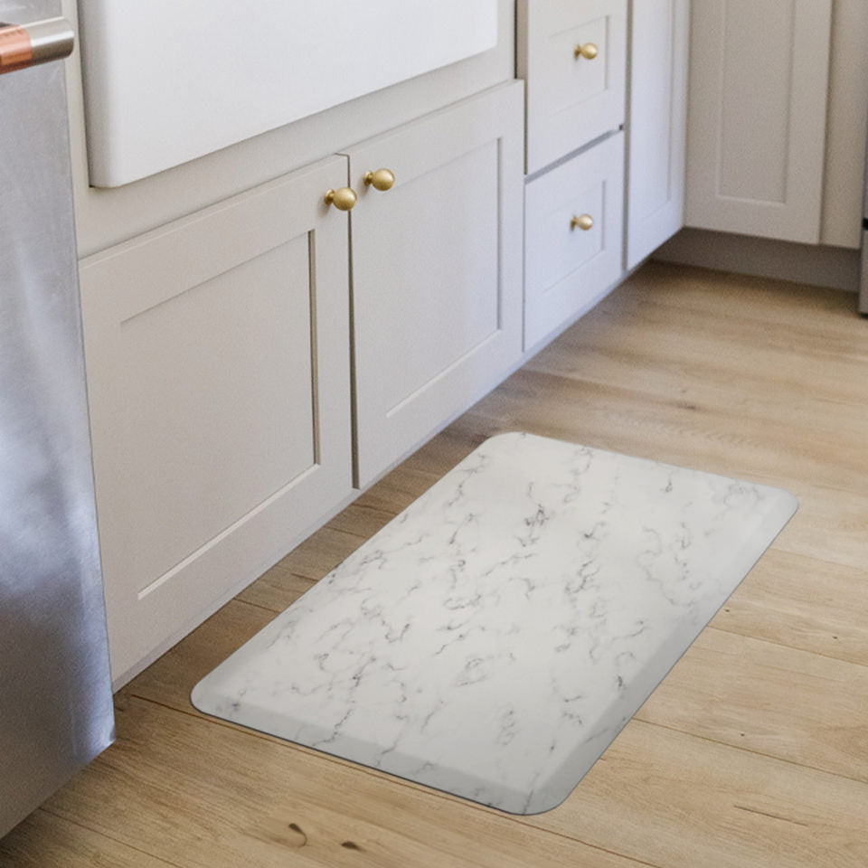 Happy Feet anti-fatigue mat in a kitchen in front of a sink for stand comfort and a waterproof surface for spills and messes