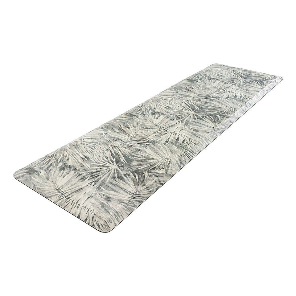 Happy Feet’s Tranquil Palms anti-fatigue runner mat at an angle showing for its beveled edges.