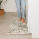 Incredibly comfortable Tranquil Palms Happy Feet kitchen comfort mat with bare feet standing on the runner.