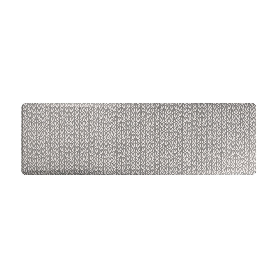 Happy Feet’s Variegated Vine anti-fatigue runner mat with a leafy vine pattern in white on a textured grey background.