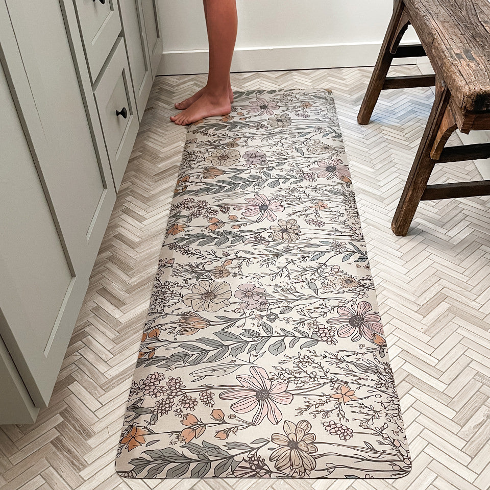 Wild Flower runner mat in a bathroom with a young kid standing on the mat.