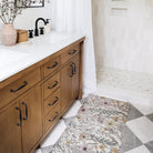 Whimsical Wildflowers anti-fatigue Happy Feet bath mat provides standing comfort to the unforgiving tile floors.