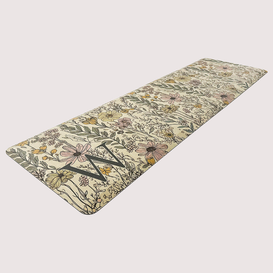 Wildflowers Monogrammed anti-fatigue runner mat on a light beige, canvas-liked textured background, with a wipeable surface.