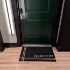 Coir on black Hashtag personalized doormat at the outside of an apartment door