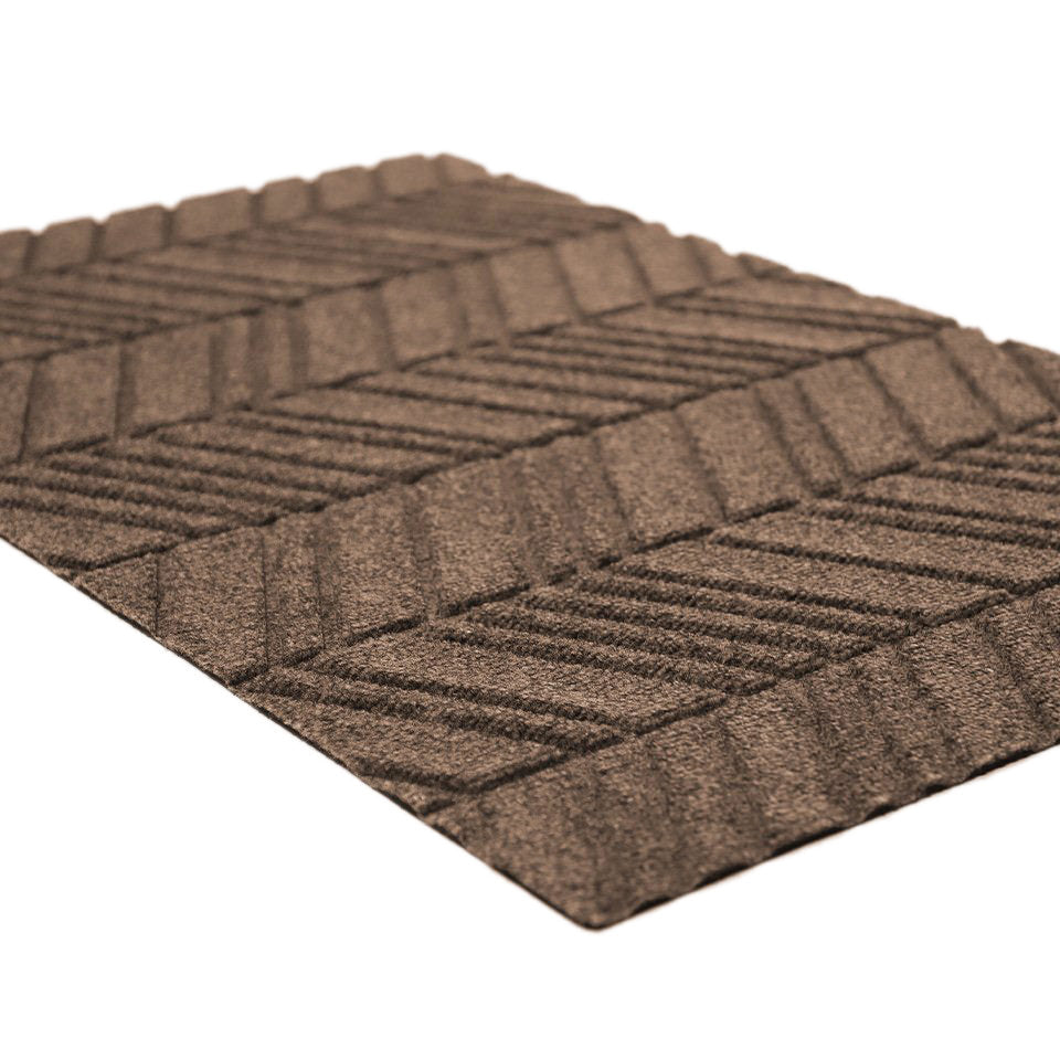 Close up of greige chevron patterned bi level doormat