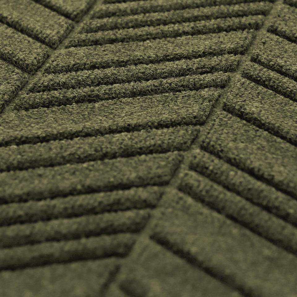 Close up of fade resistant non shedding fibers on our chevron bi level doormat 