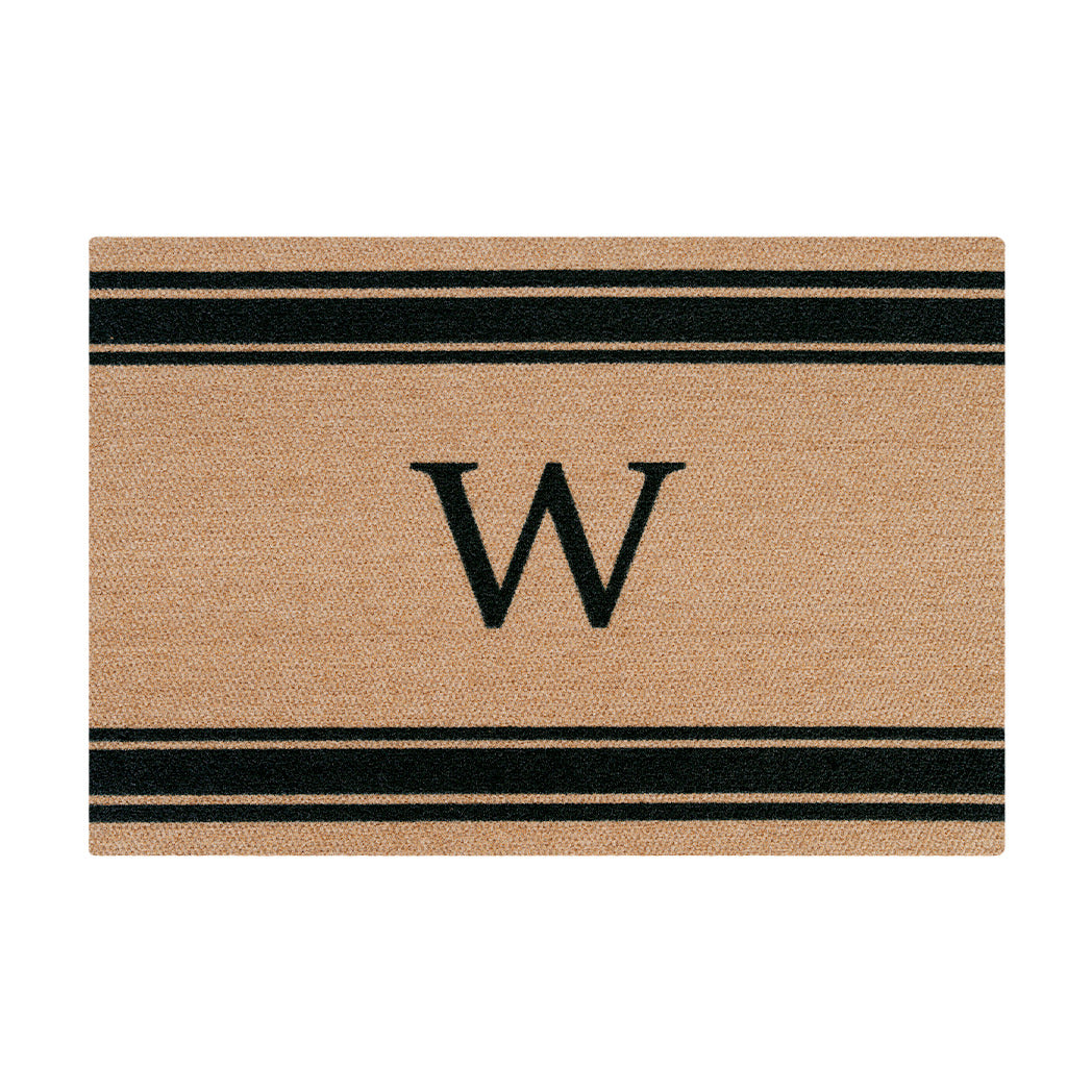 Large coir doormat monogrammed with a serif W in black with three horizontal stripes above and below