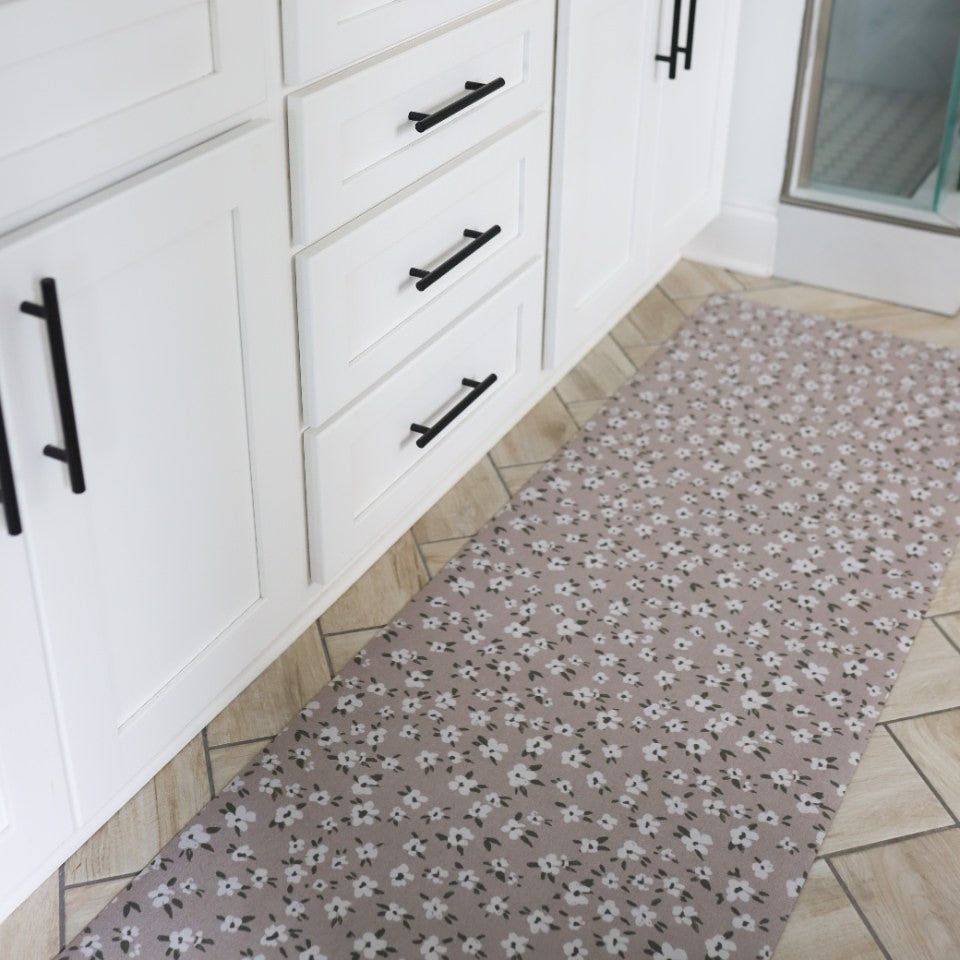 Rubber backed Un-Rug serves as a great bathroom mat while being placed at the base of a bathroom vanity.