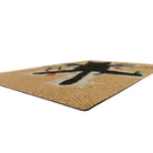 Rubber backed Christmas welcome mat on durable surface that looks like coir doormat.