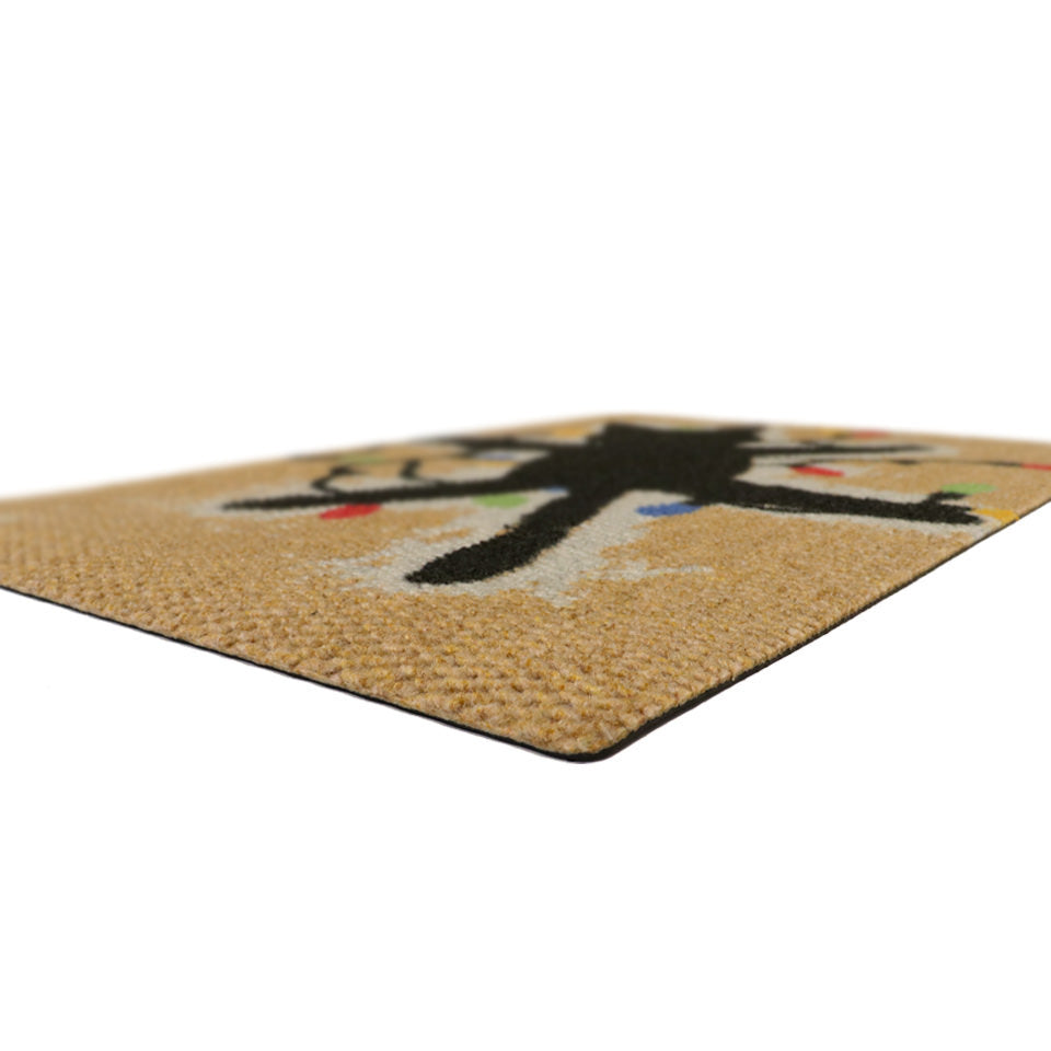 Rubber backed Christmas welcome mat on durable surface that looks like coir doormat.