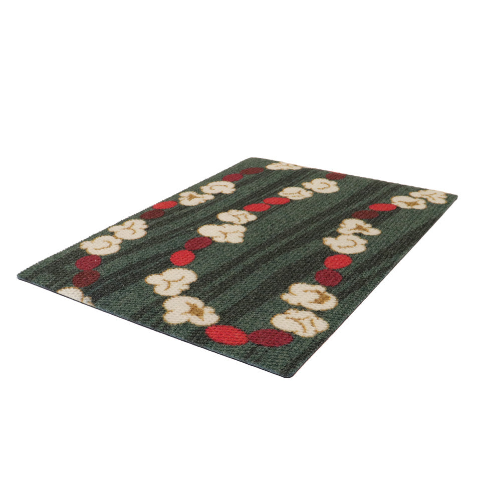 Classic holiday themed doormat featuring a classic garland design with pops of red and white on a dual green background in a single door size..