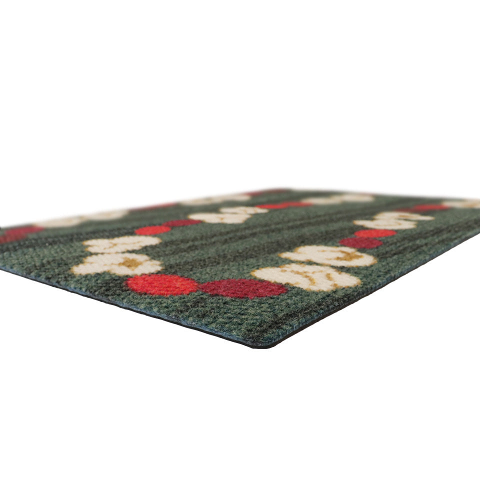Classic holiday themed doormat featuring a classic garland design with pops of red and white on a dual green background has unique textured surface and a durable rubber backing