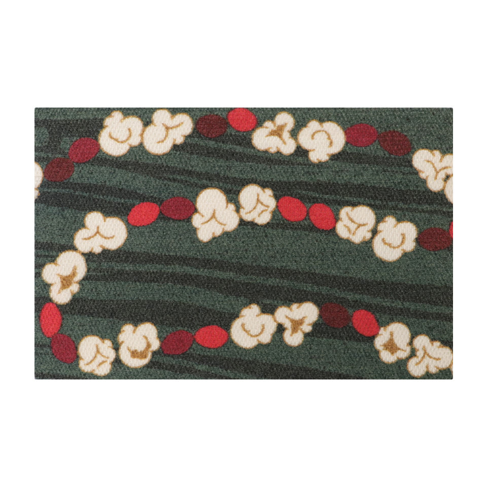 Classic holiday themed doormat featuring a classic garland design with pops of red and white on a dual green background.