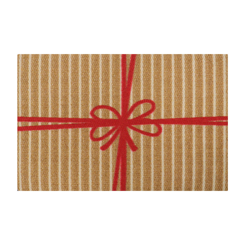 Cute holiday themed door mat that looks like a brown and white striped present with red bow.