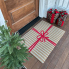 Neighburlys Brown Paper Bag single doormat at a front door with a decorative tree and presents