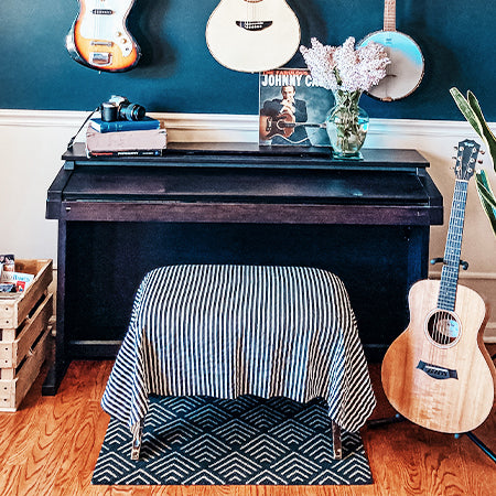 Floormat placed below stool in music room as an accent mat.