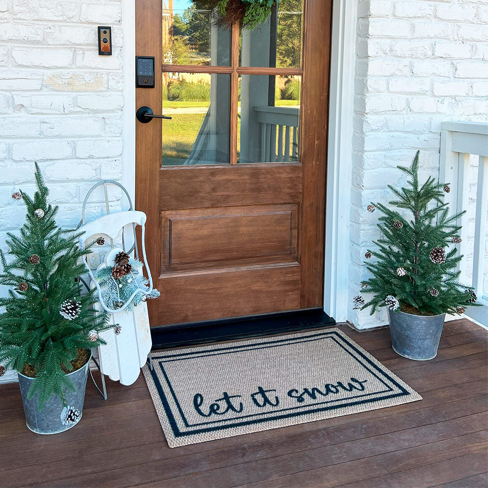 Around the Block personalized with Let It Snow with two small decorative trees on its sides.