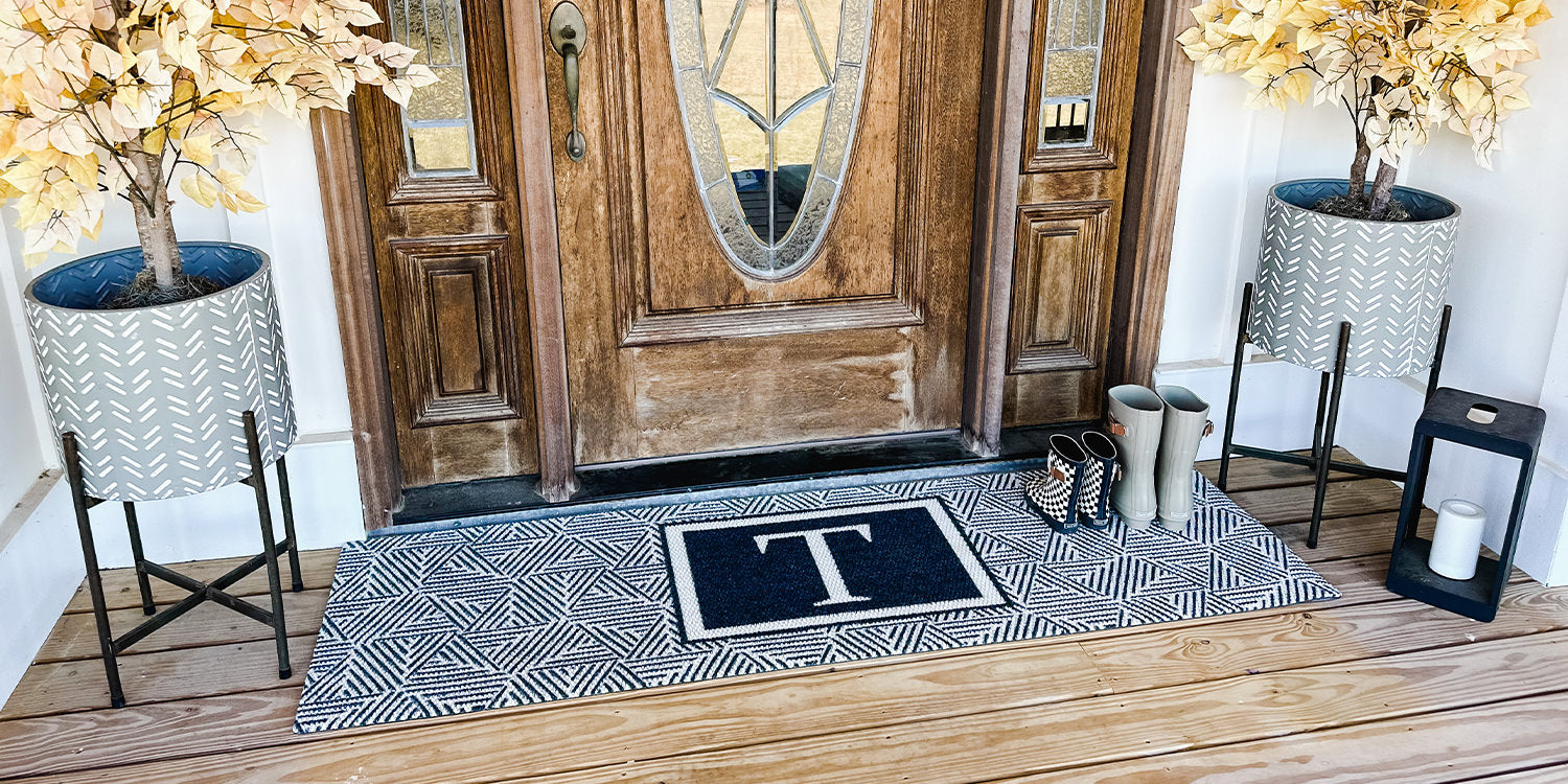 Neighburly Escher double door mat monogrammed with the letter T, all colored in black and white.