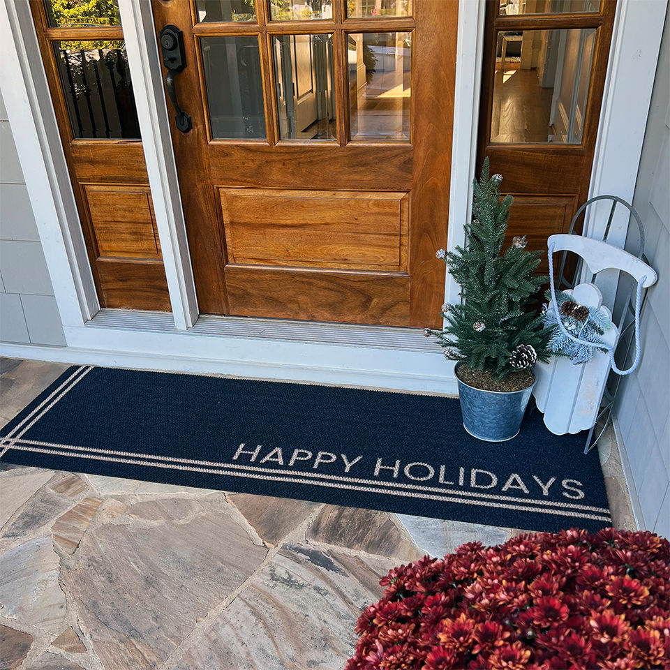 A double door Hashtag personalized with Happy Holiday at a front door.