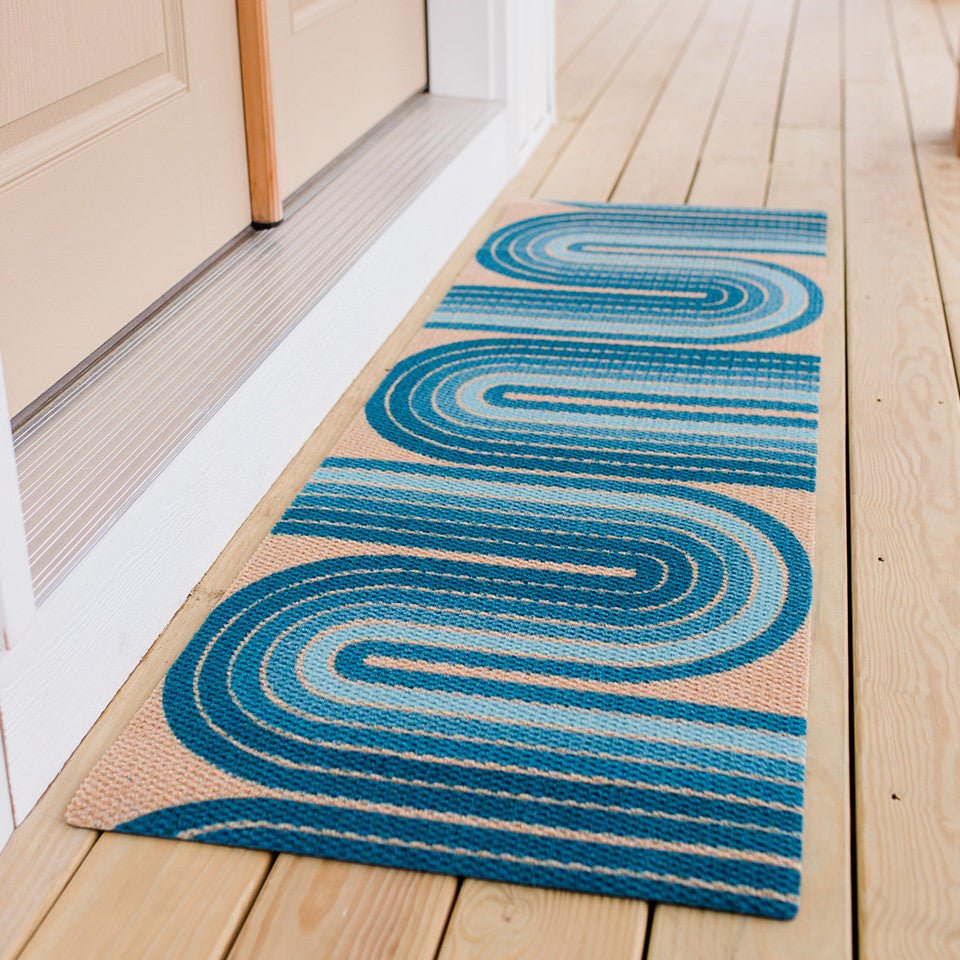 Neighburly Retro Vibes double door doormat in the color blue on coir on a front porch.