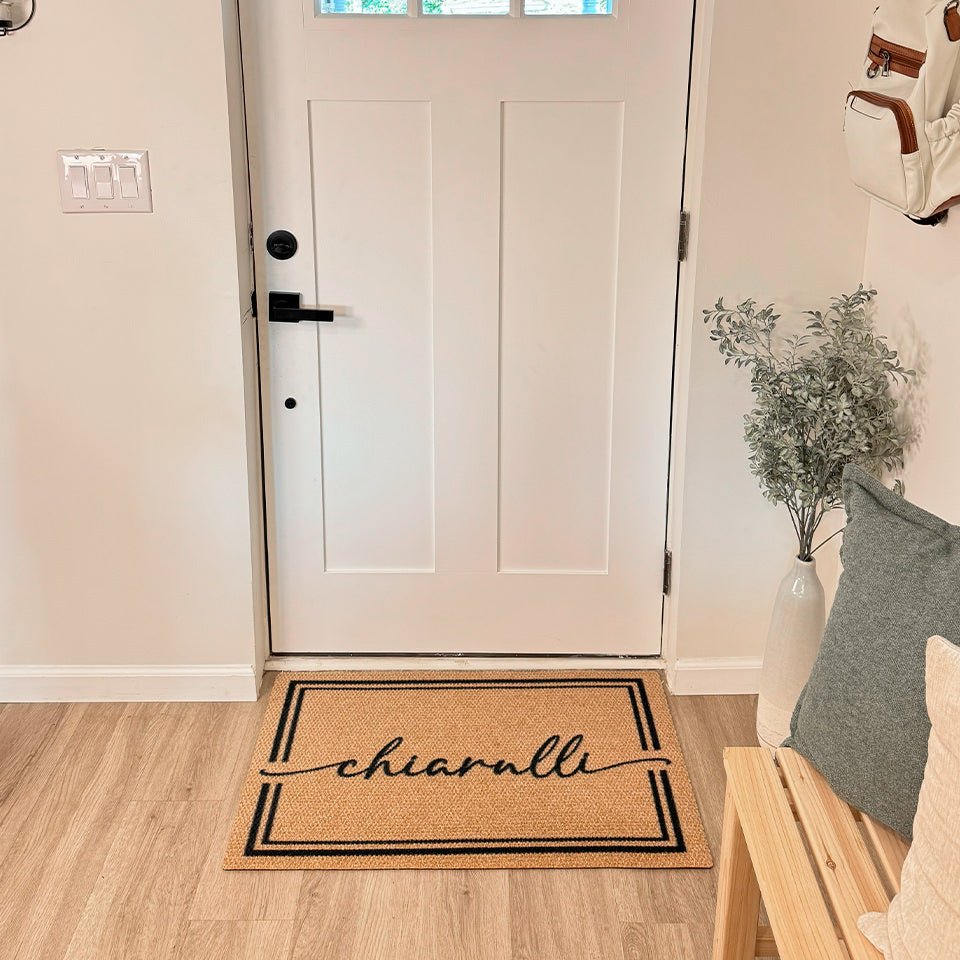 Neighburly Surname Script personalized with the name Chiaralli placed at the inside the front door of a home.