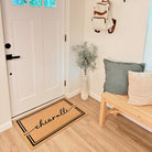 Low-Profile Surname Script indoor mat personalized with the name Chiaralli in all lowercase across the center of the non-shed mat.