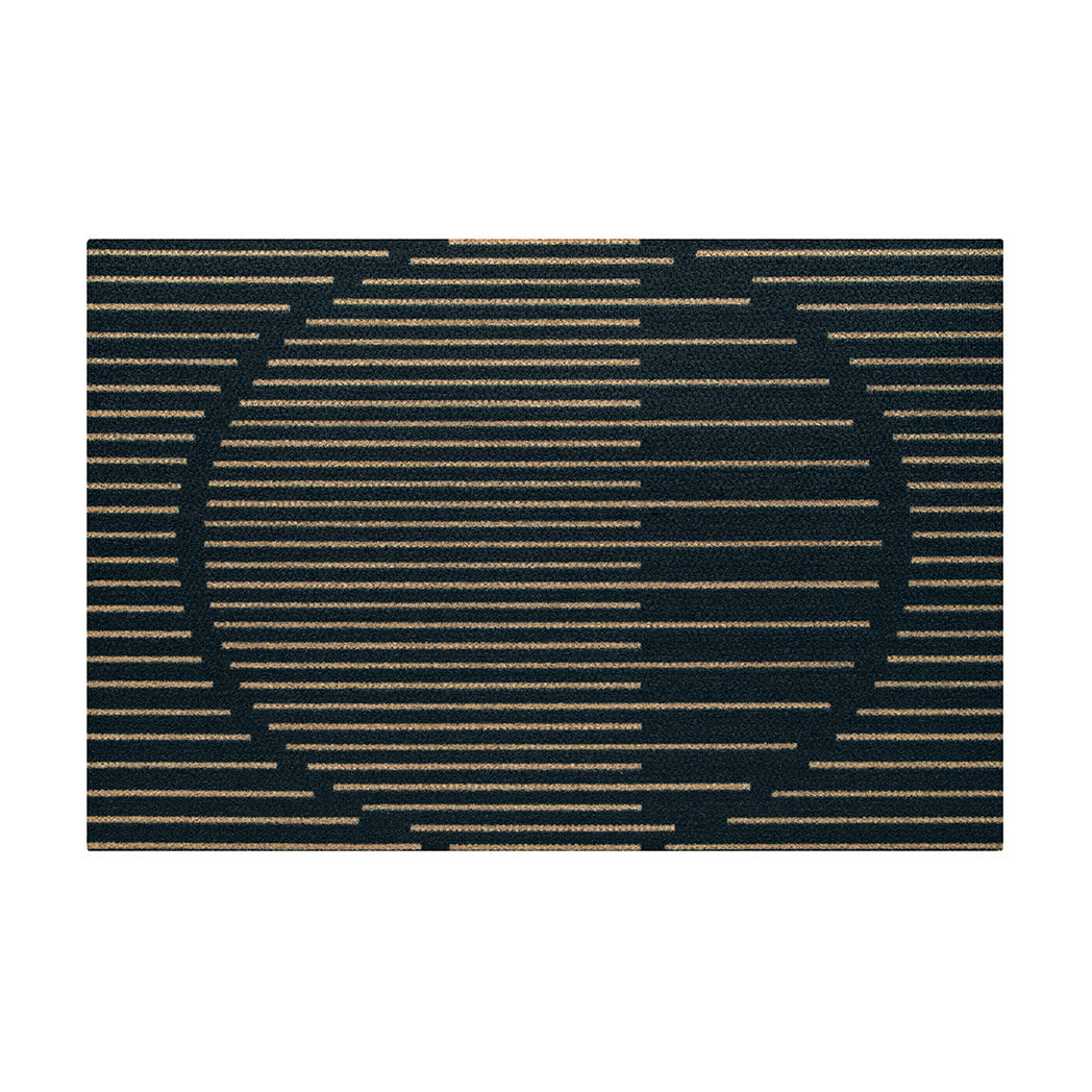Top view of Neighburly's doormat with a coir, abstract sunset scene made of horizontal lines, on a black mat