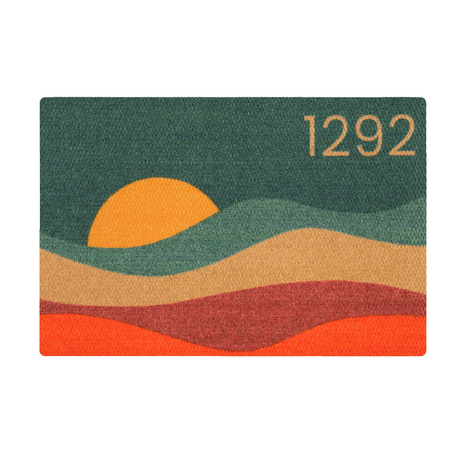 Overhead single door Personal Sunset mat with house numbers in vibrant colors of aquas, coir, maroon, orange, and yellow.