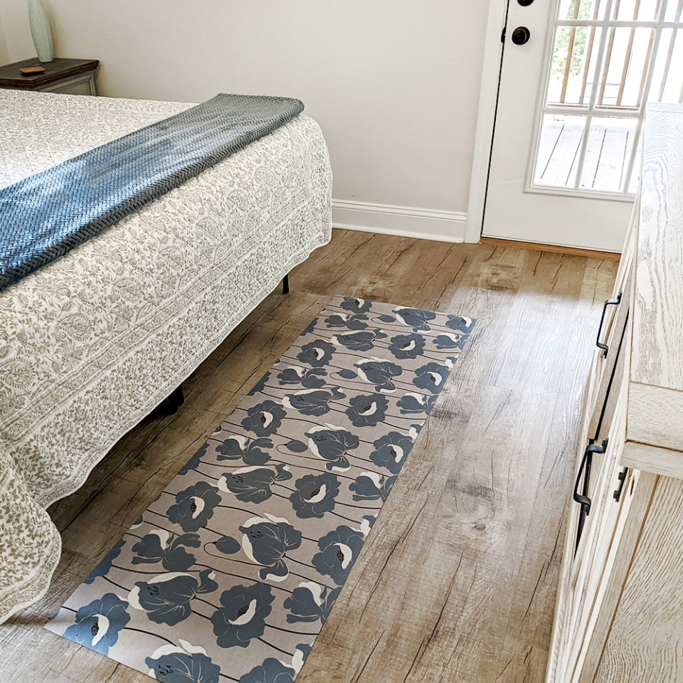beautiful mat with neutral light beige (shiitake) base with poppy flowers all over in a storm cloud blue shade in a bedroom