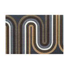 The groovy Retro Vibes Neighburly doormat with brown, blue, grey and white stripe making racetrack-like pattern on a dark grey/blue background