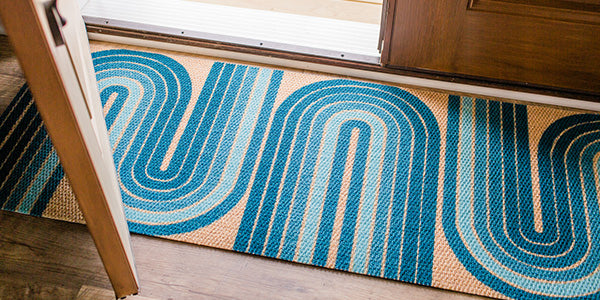 Retro Vibes doormat at the entrance of a home.