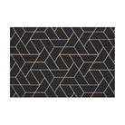 Top view of Neighburly's Triangulation large doormat made of geometrical triangle patterns, coir-colored, on a black mat