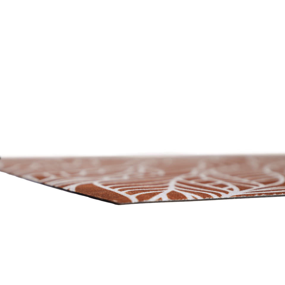 Super low profile corner shot of Abstract cream colored leaf pattern on burnt orange linen look low profile washable floormat
