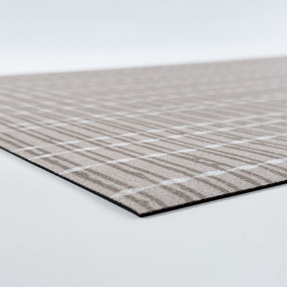 Close-up corner image of Bounce Weave -  incredibly low-profile with rubber backing for minimal movement.