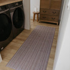 Medium runner Boucle Weave runner mat places in a laundry room for floor protection and style