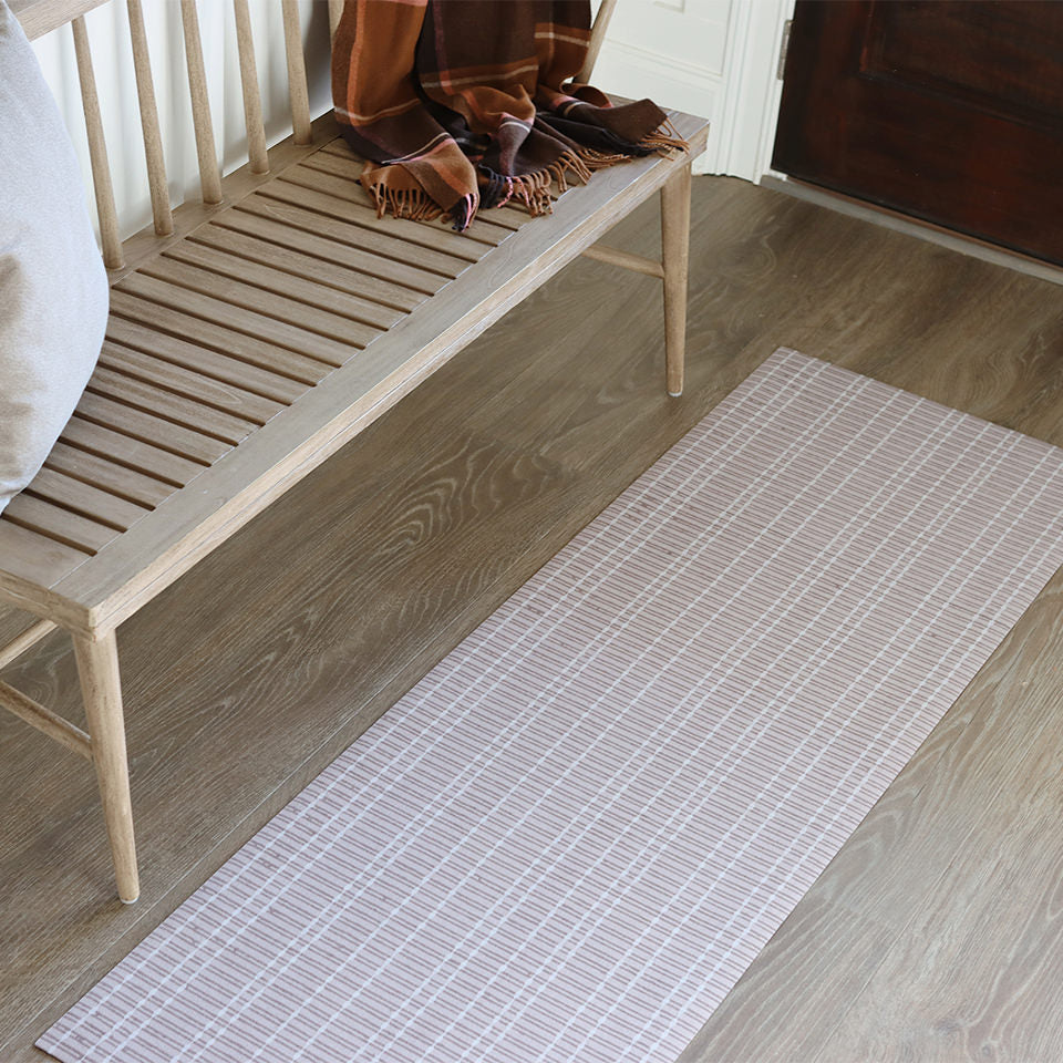 Un-Rug's Boucle Weave runner in front of a hallway bench for floor protection and stylish design