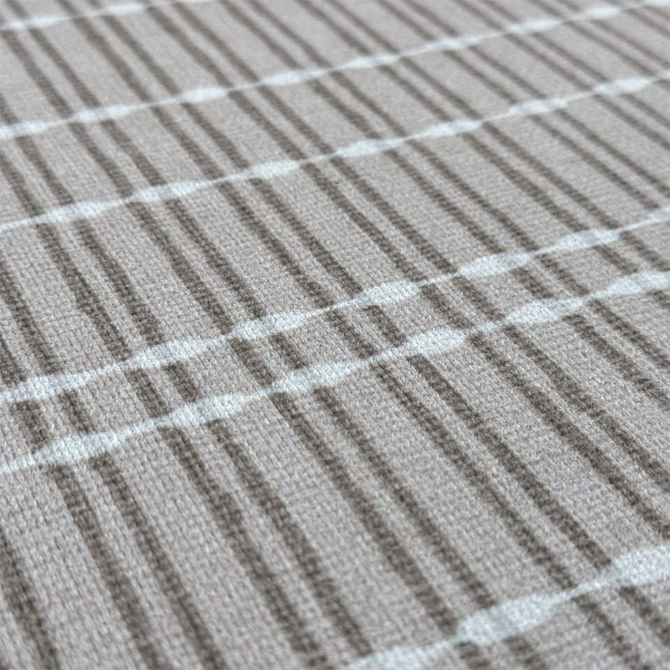 Detailed image of Un-Rug’s Boucle Weave soft knit surface and linear pattern on a washable surface and rubber back.