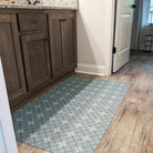 Un-Rug Bright Plaid low-profile mat in front of a vanity protecting the bathroom floors.