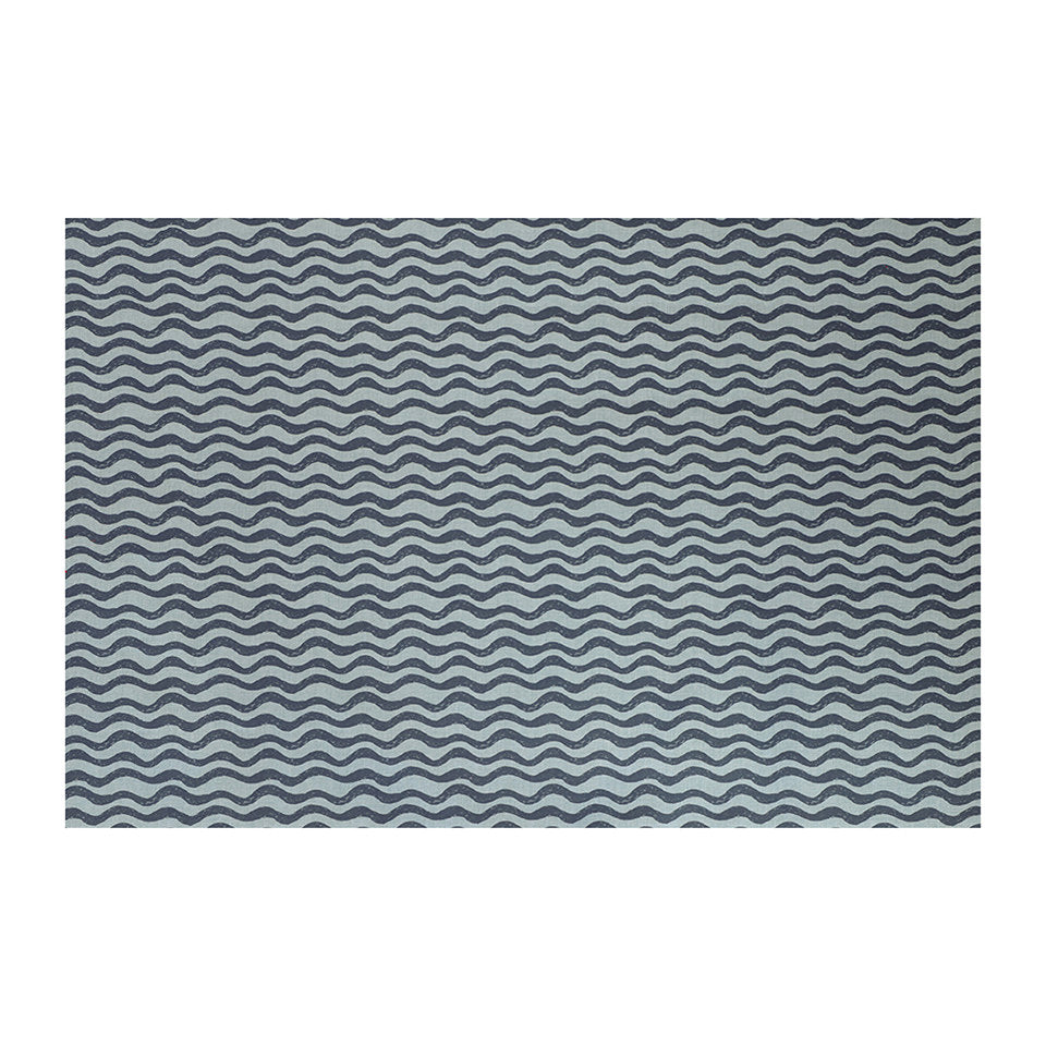 Coastal blues in an organic waved pattern on a washable low profile indoor floor mat