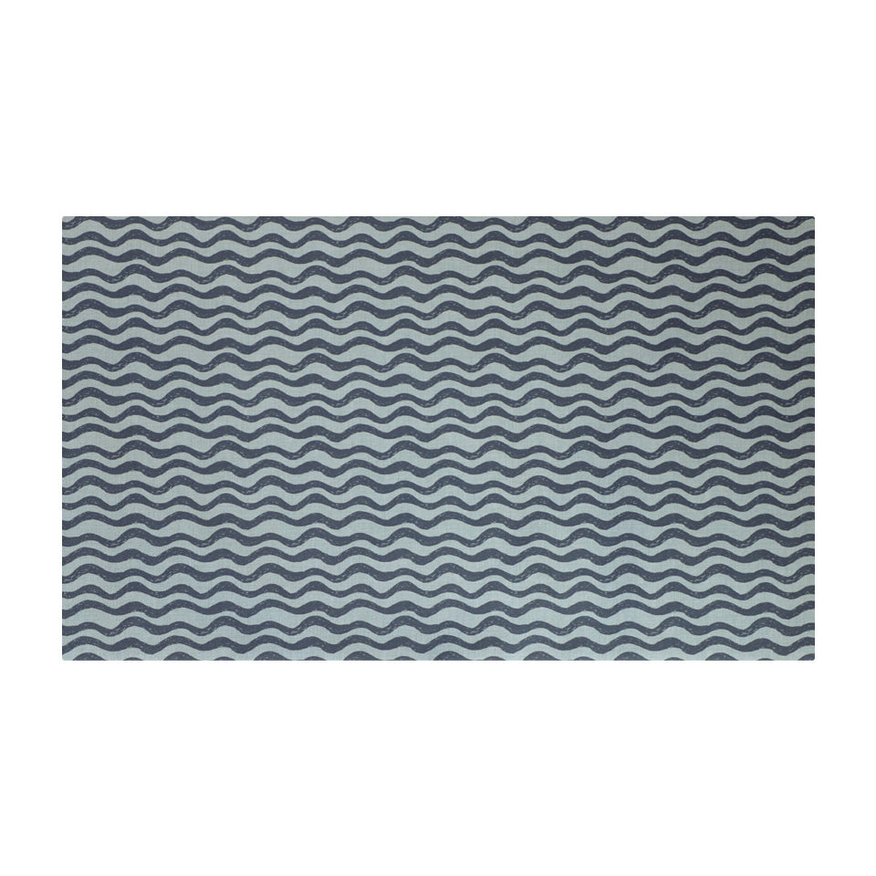 Coastal blues in an organic waved pattern on a washable low profile indoor floor mat