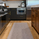 Low-profile, machine-washable rug in a kitchen for floor protection