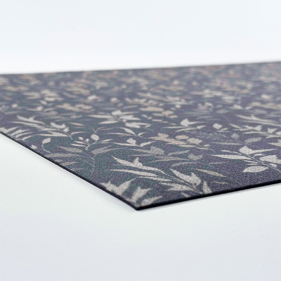 Image of Un-Rugs Ditsy Floral mat's low-profile, one-piece construction that is machine washable.