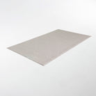 Overhead angle shot of Shiitake tan colored linen background with white dotted fan design on a low profile washable floor mat