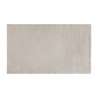 Overhead shot of Shiitake tan colored linen background with white dotted fan design on a low profile washable floor mat in medium