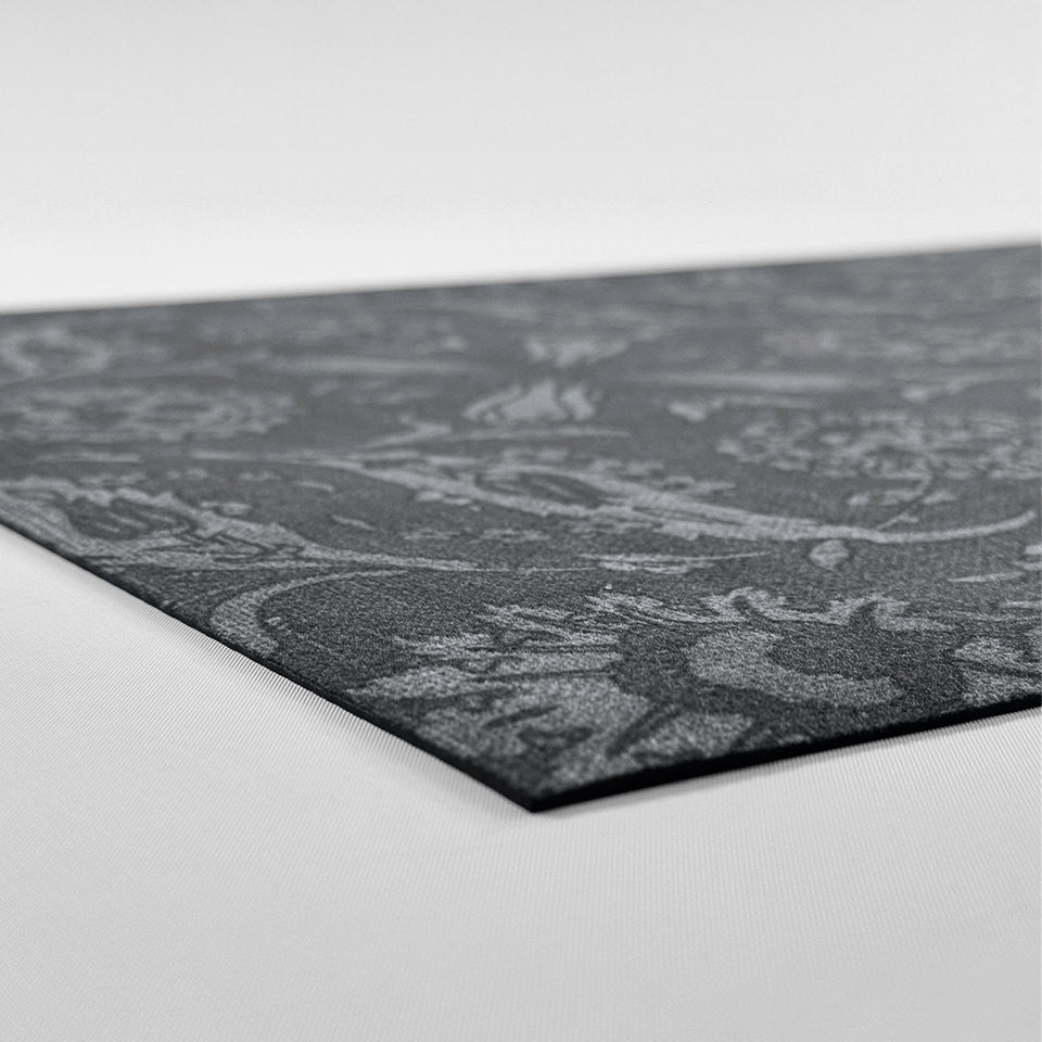 Low-profile image of Filigree Floral mat that is a single piece construction and machine washable.