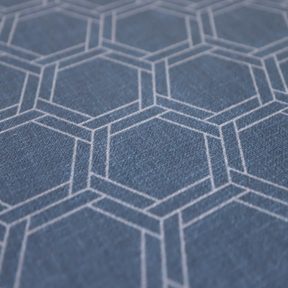 Close up of Storm cloud blue linen look with double honeycomb accent design in shiitake tan printed on a low profile washable indoor floor mat