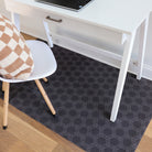 Un-Rug Honeycomb mat in deep urbane bronze as a desk mat for its low-profile and rubber backing.