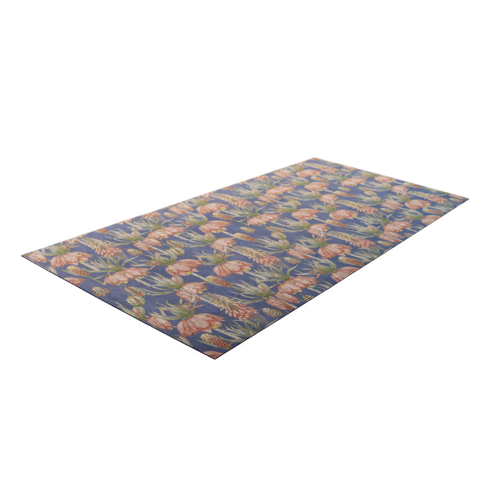 Overhead side angled shot of Dark floral print with pink flowers on blue grey background on a low profile washable floor mat