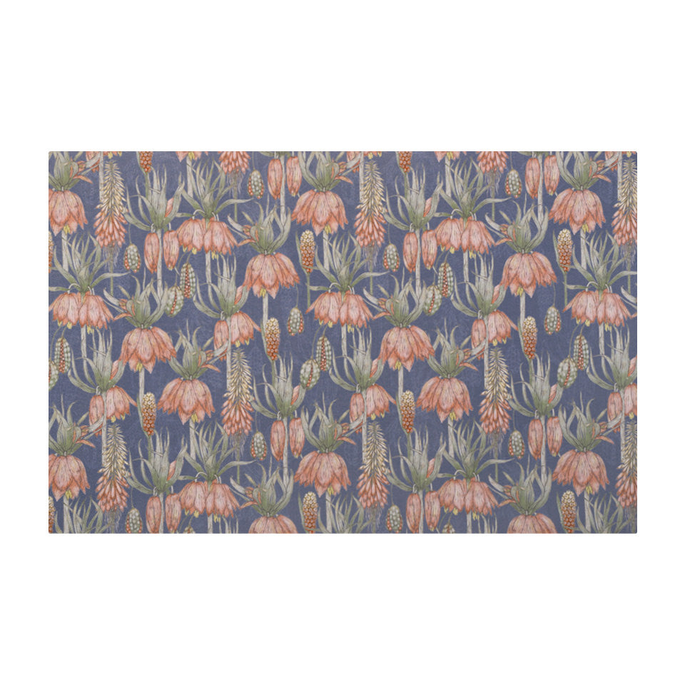 Overhead shot of Dark floral print with pink flowers on blue grey background on a low profile washable floor mat size small