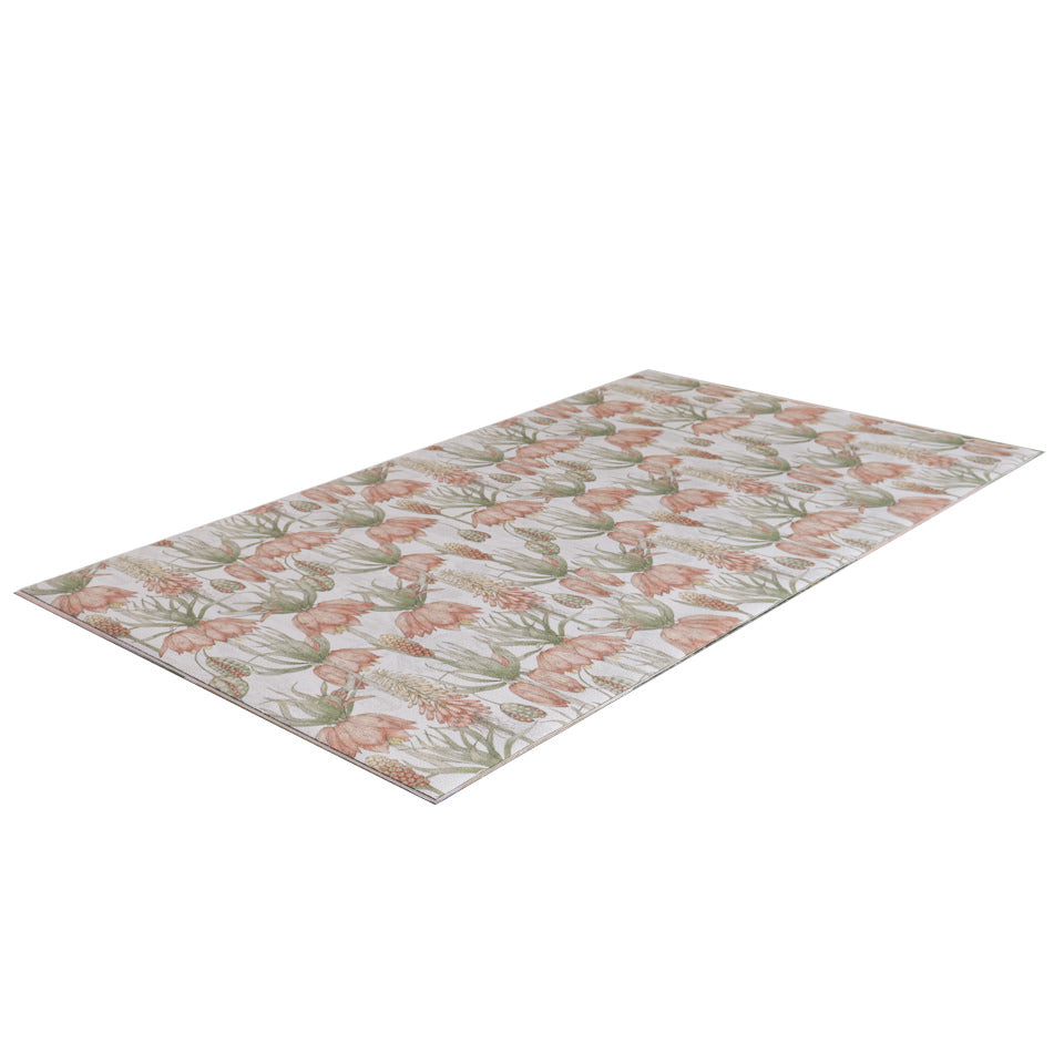 Overhead angle photo of Light floral print with pink flowers on light grey greige background on a low profile washable floor mat 
